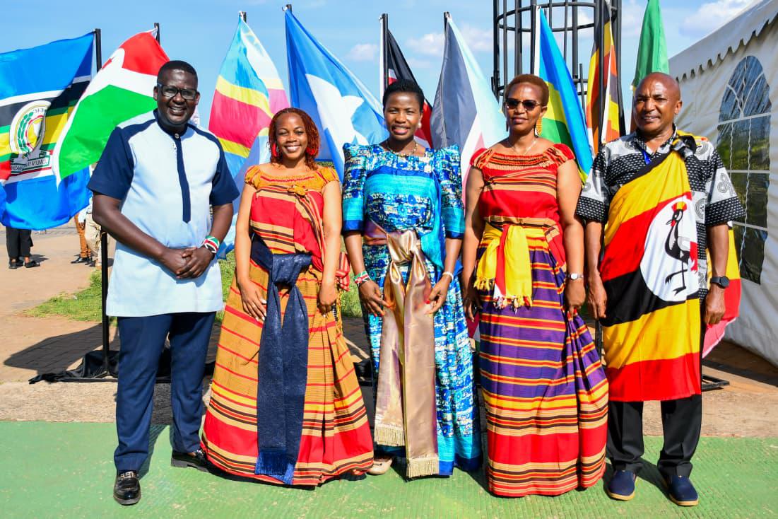 Principal Secretary MSMEs Development pose for a photo alongside various dignitaries at the EAC MSMEs Trade Fair, Uganda Day