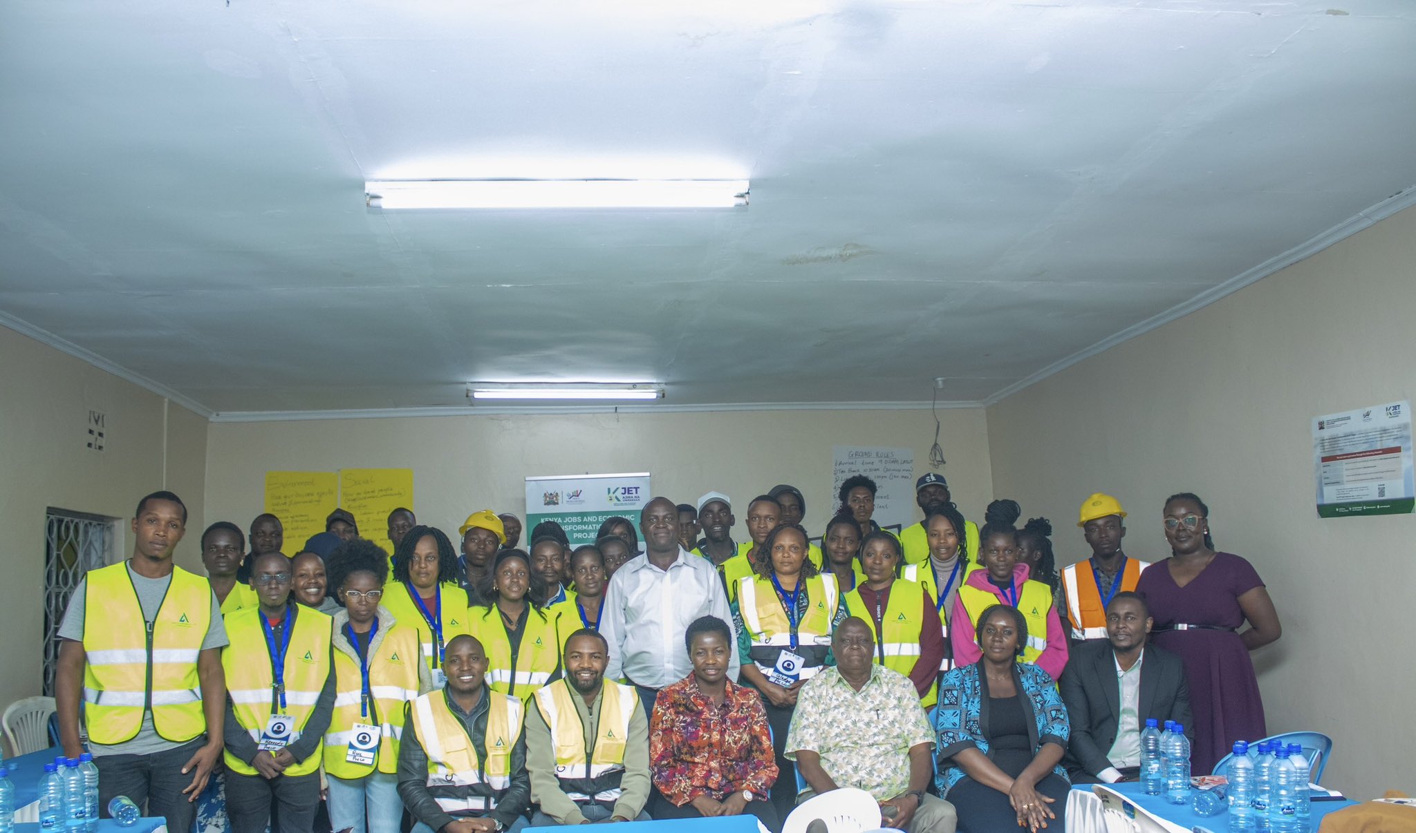 Principal Secretary poses for a photo among benefitiares of the Kenya Jobs and Economic Transformation Program