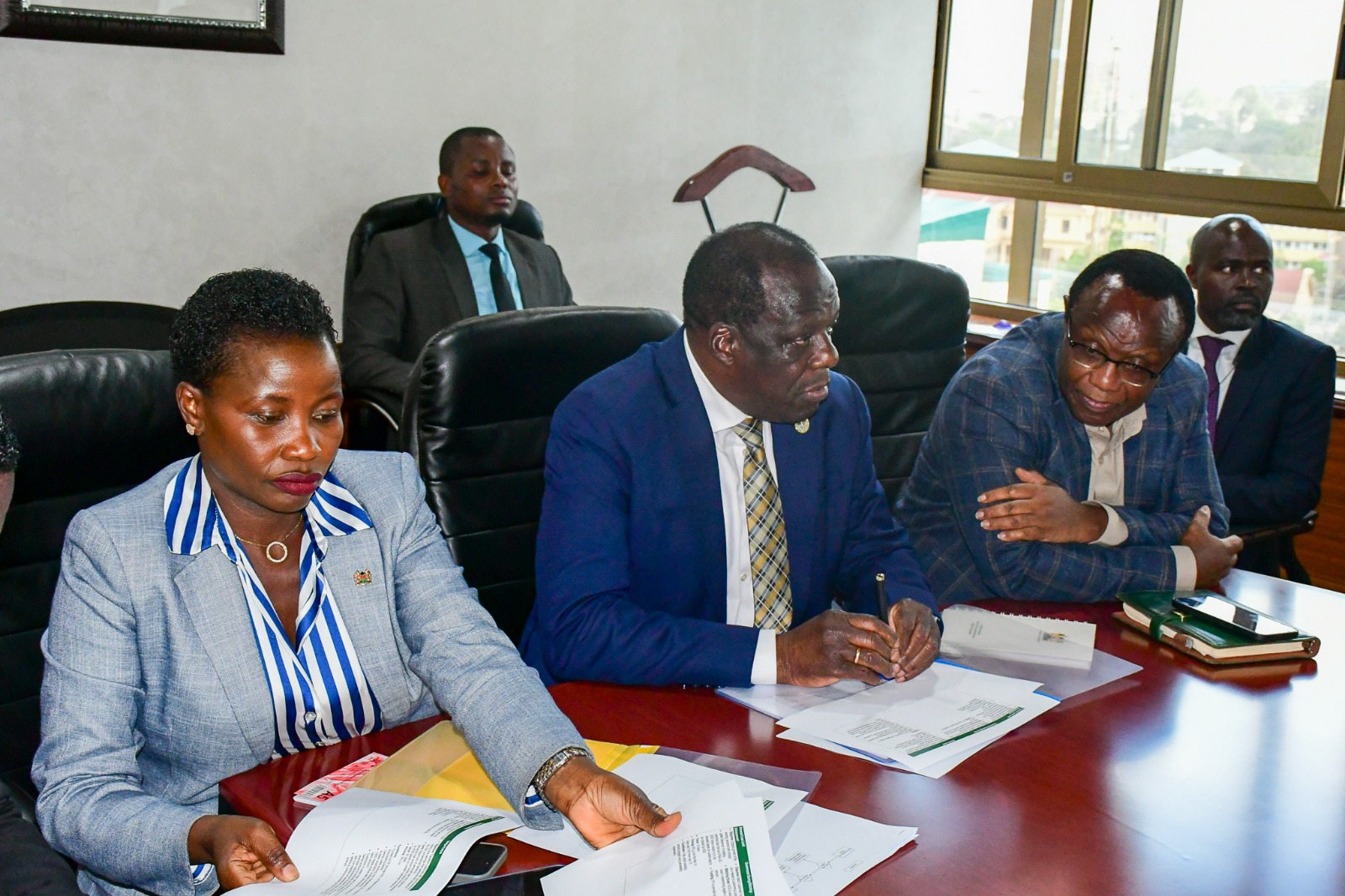 PS Hon. Mang'eni alongside CS Hon. Oparanya and government economic advisor David Ndii