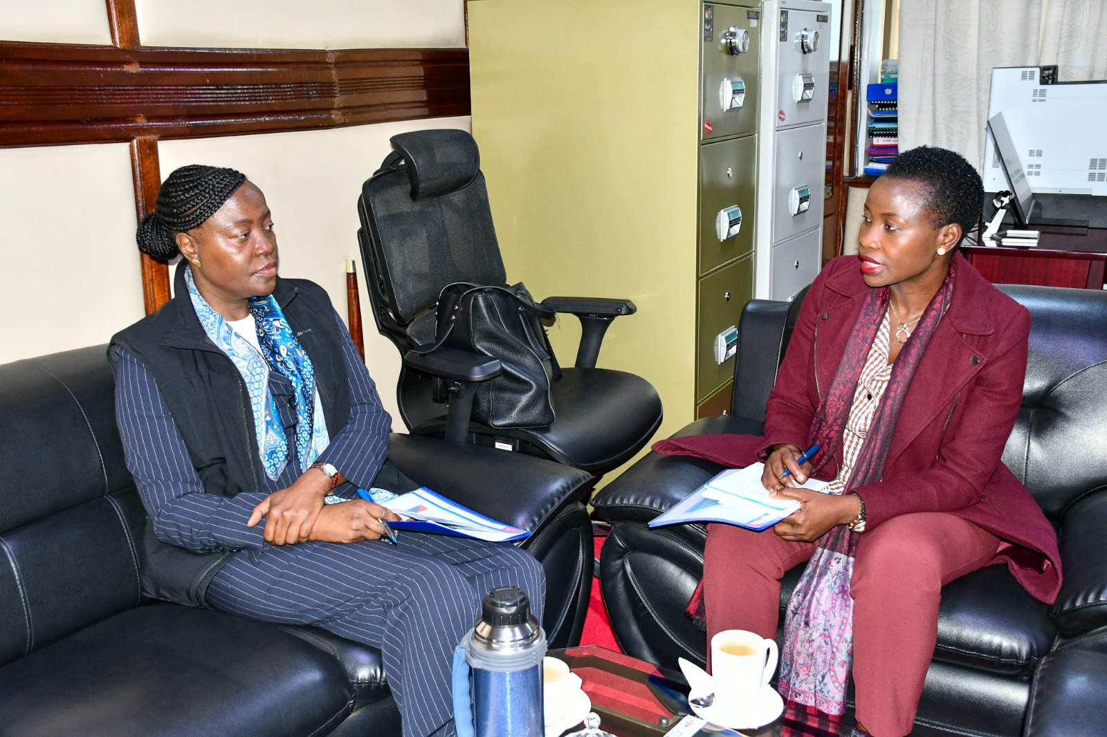 PS. MSME Development Hon. Susan Mang'eni engaging Madam Vivianne Yeda, Director of East African  Development Bank)