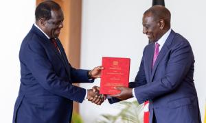 Cabinet Secretary Ministry of Co-operatives and MSMEs Development Hon. Wycliffe Oparanya hands over PC to HE. Dr. William Samoei Ruto