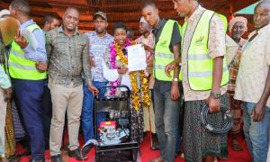 PS officially handover over a fully equipped car wash facility and Certificate of registration to 18 groups