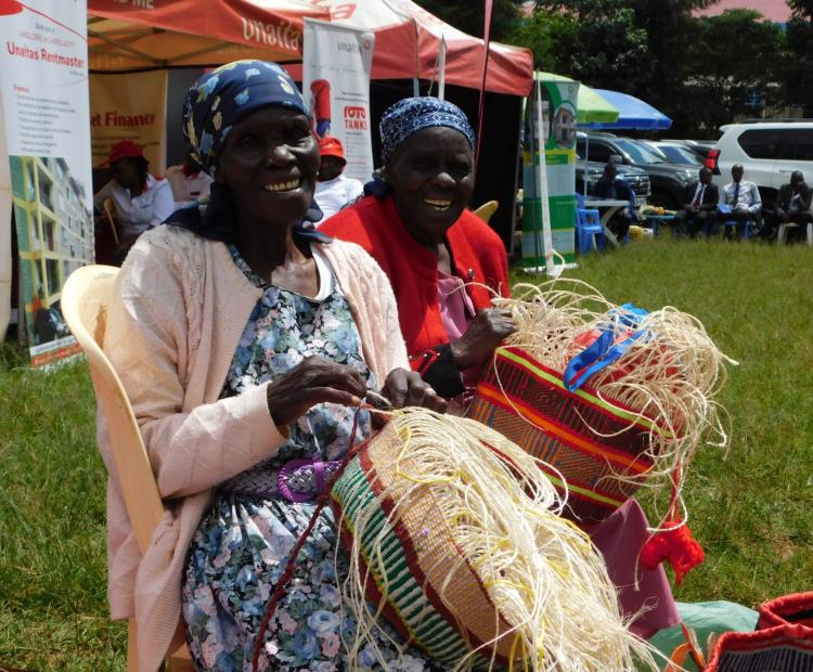 Women weaving kiondos at the Kigumo weavers basket