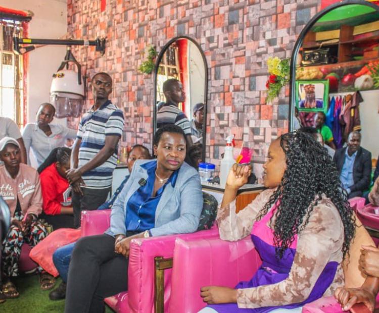 Principal Secretary Hon. Susan Mangéni alongside NYOTA Beneficiary